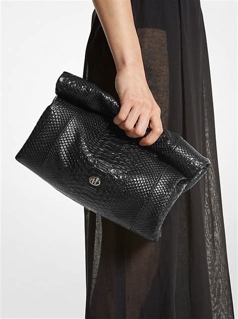 michael kors python embossed clutch|michael kors monogramme bags.